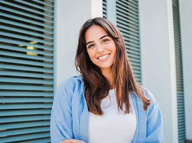 Woman smiling after completing cosmetic treatment